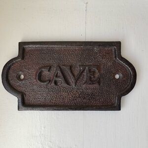 Vintage cast iron wine cellar sign